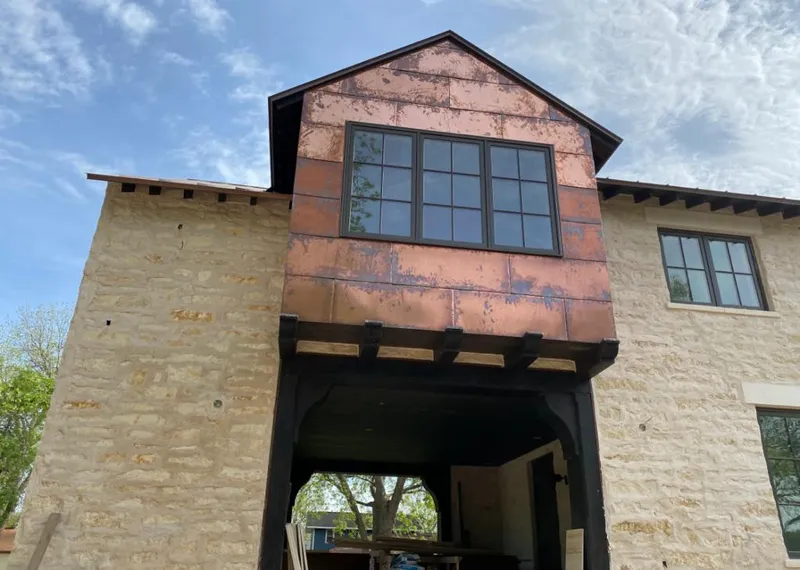 Copper metal panel facade on a stone building for Metal Roof Coating in Shiprock